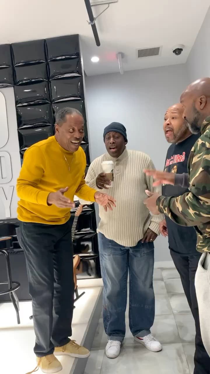Lawrence Dopson singing harmony with three vocalists
