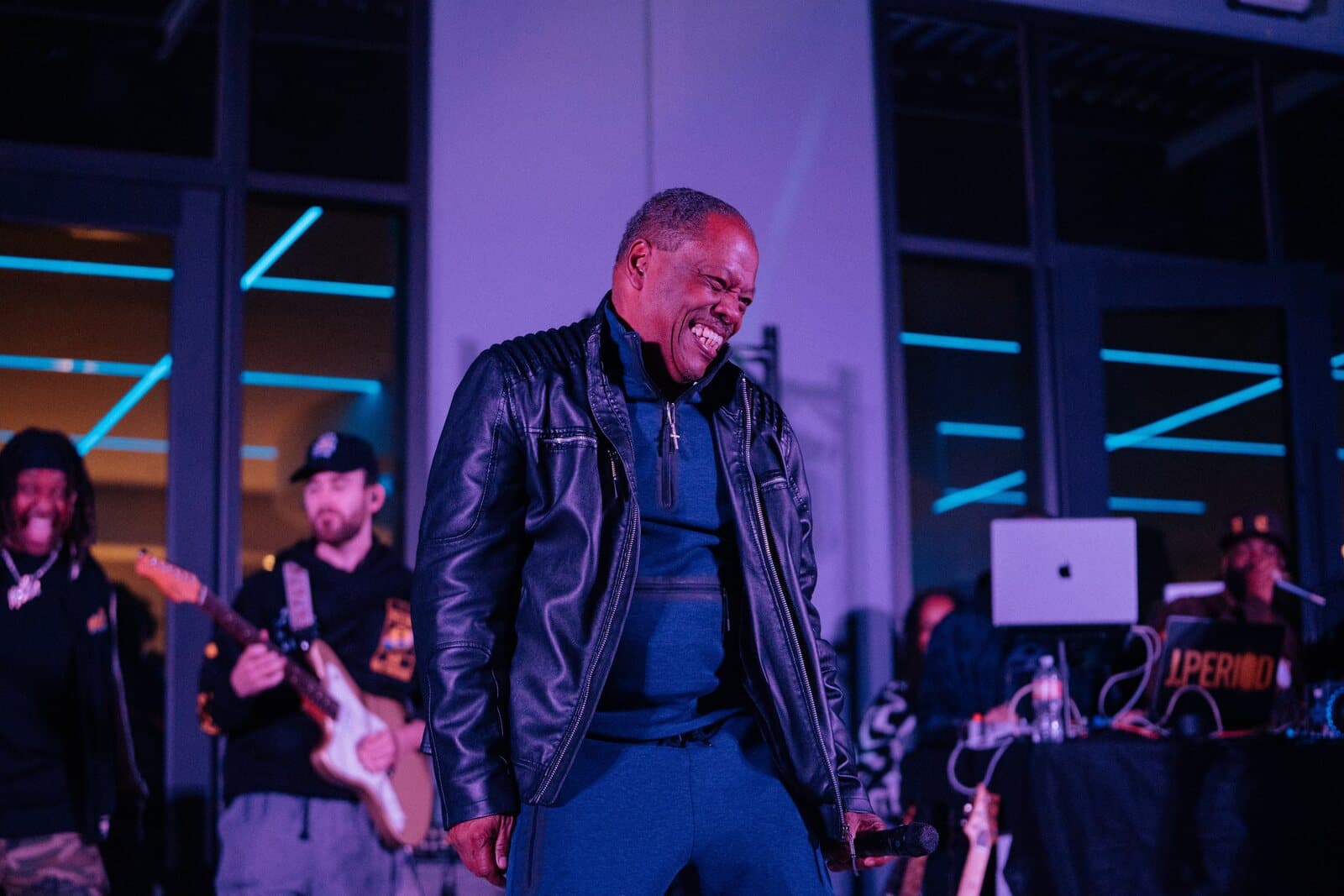Lawrence Dopson laughing on stage with his band
