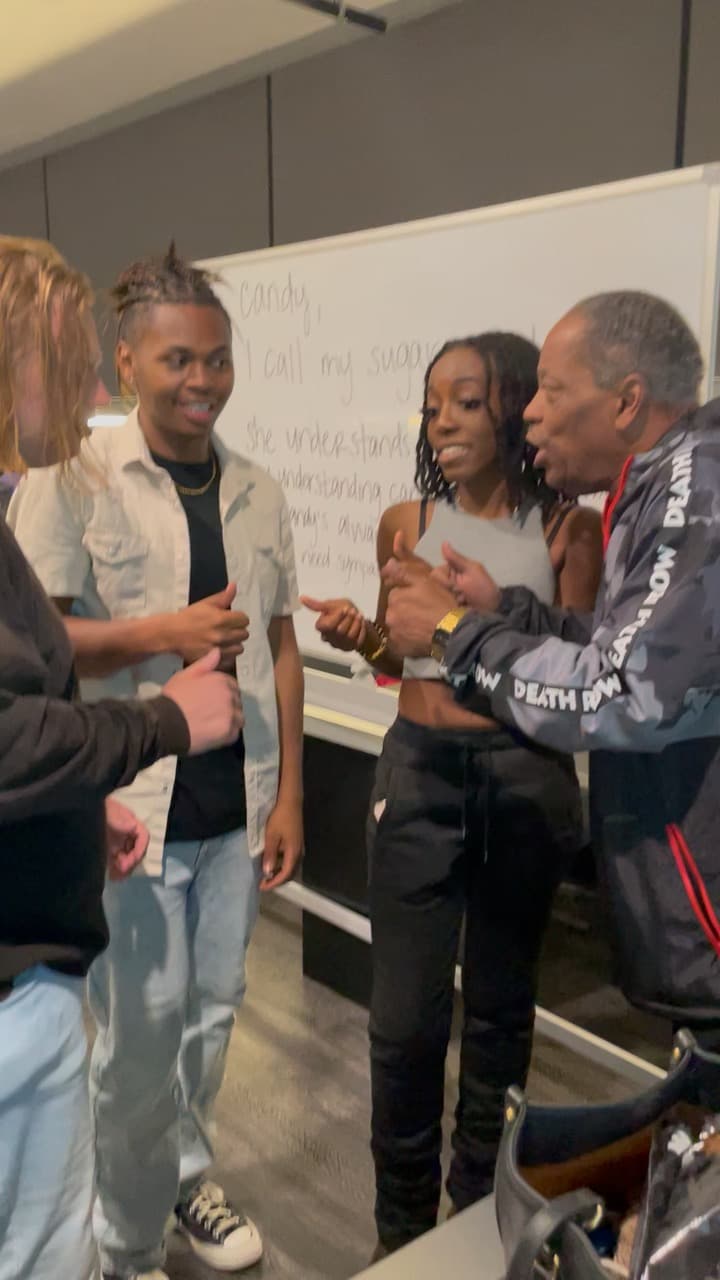 Lawrence Dopson celebrating with two students