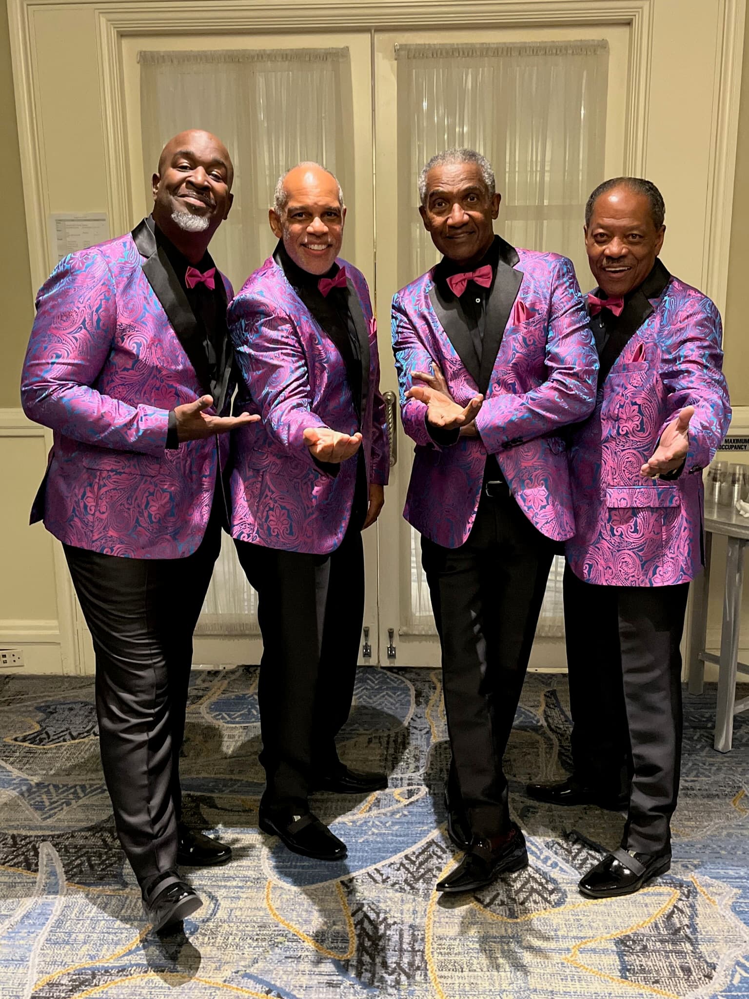 Lawrence Dopson with his vocal group in matching stage jackets